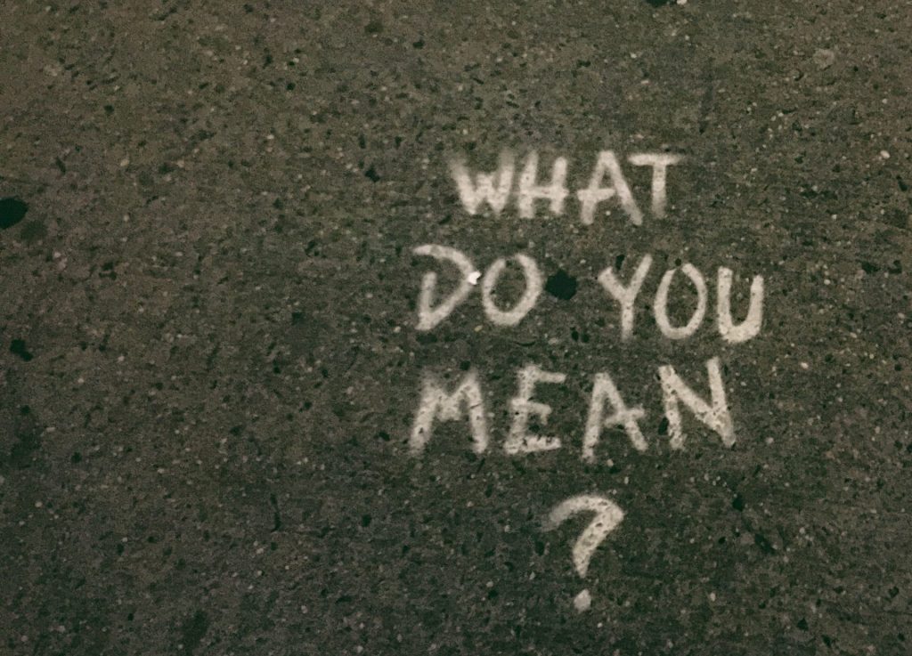 Chalk writing on concrete saying 